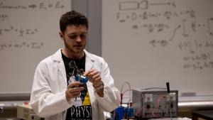 PIRT Lab Coordinator explaining the components of the electromagnet