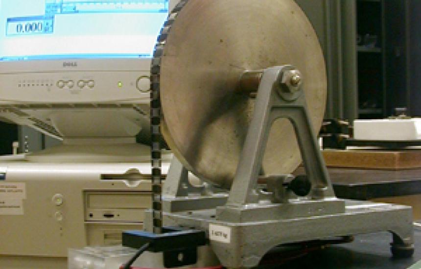 Science Workshop measures the acceleration of the falling weight as the disk rot