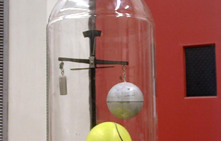As the density of air decreases so does the buoyancy on the larger volume sphere