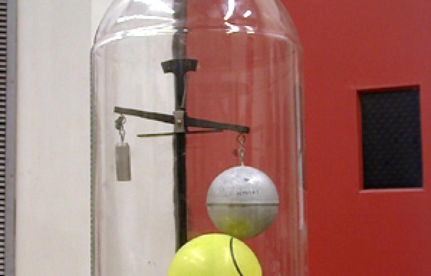 The sphere is clearly heavier in a vacuum that the counter balance weight.
