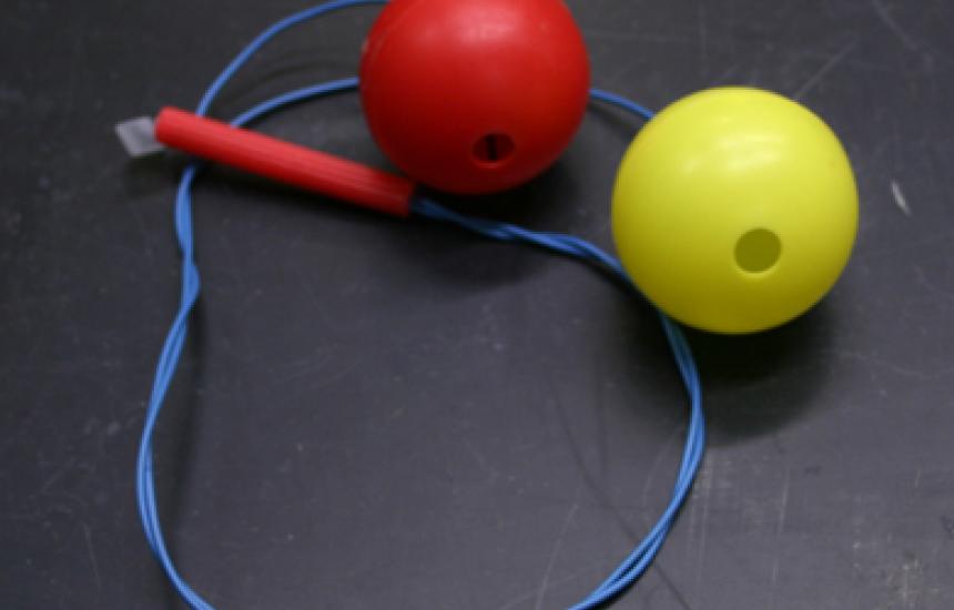 Spin the balls around your head and they make a whistling sound.