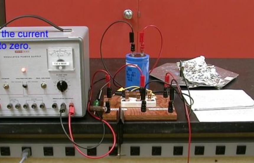 When little current is detected the capacitor is fully charged.