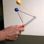 A common toy that demonstrates collisions of two equal masses 
