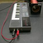 The keyboard plays music with its speaker off through the coil.