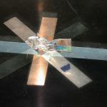 Cellophane tape is put on piece of glass in various directions. Another piece of